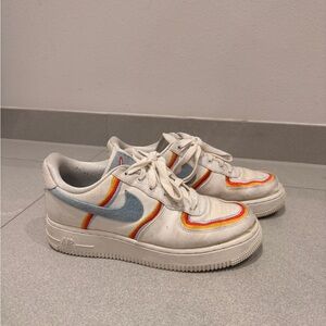 Retro White Low-Top Sneakers with Blue Swoosh and Rainbow Trim